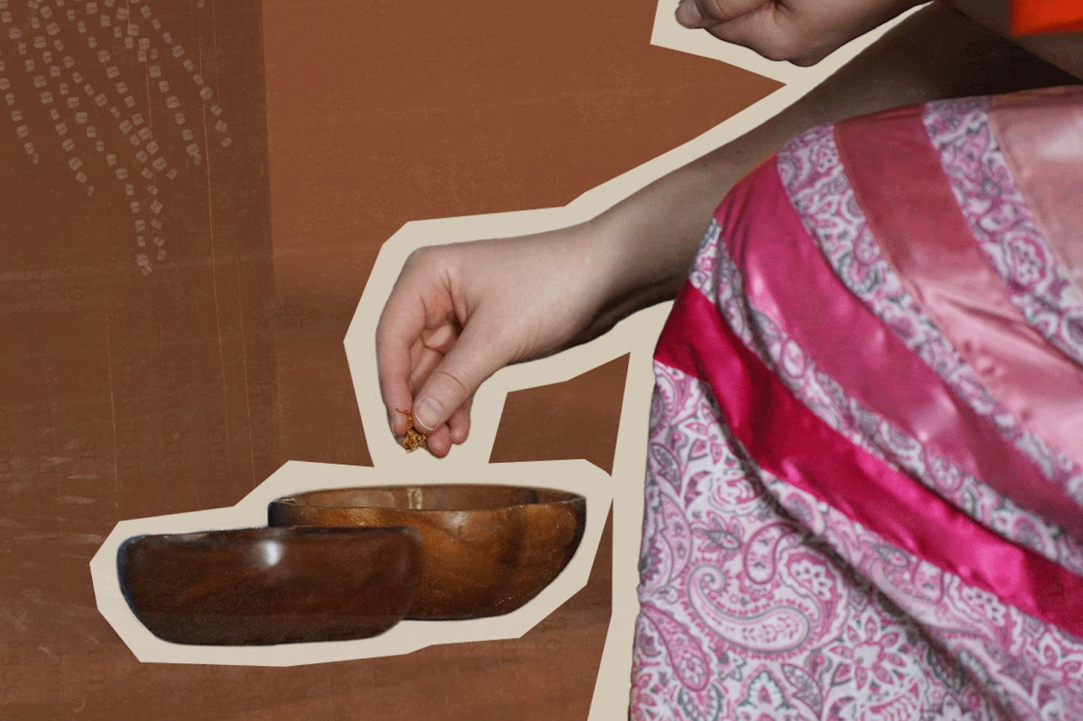 A women wearing a ribbon skirt takes loose tobacco from a wooden bowl