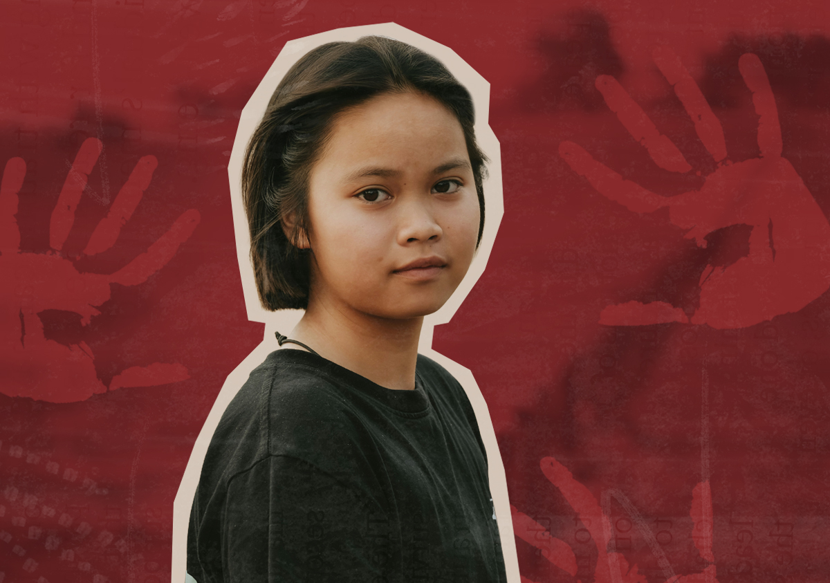 A young Indigenous girl looks at the camera. Behind her is a natural landscape and red handprints.