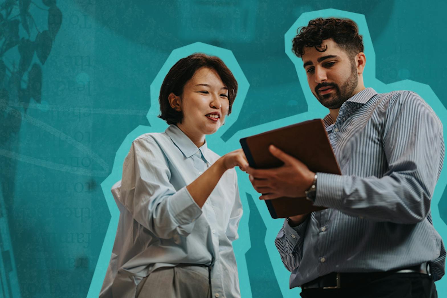 A woman and man review notes on a clipboard