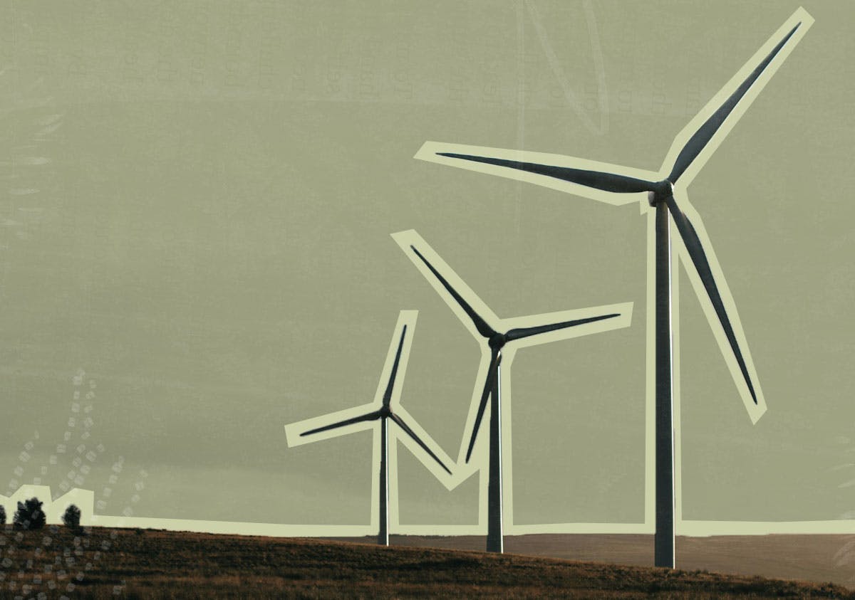 A row of windmills in an open field