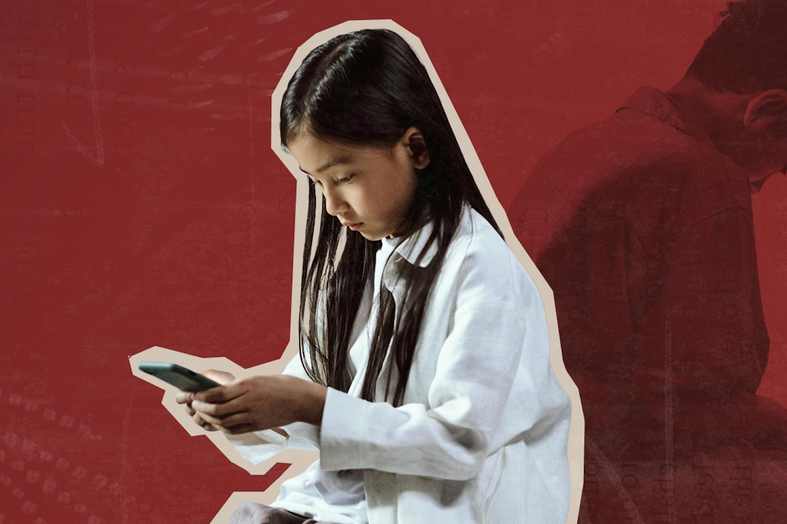 A young girl looks down at a phone screen