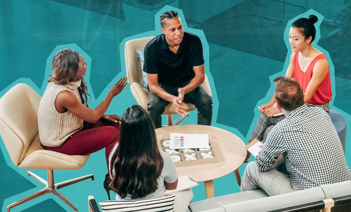 A group of diverse people sitting around a table conversing