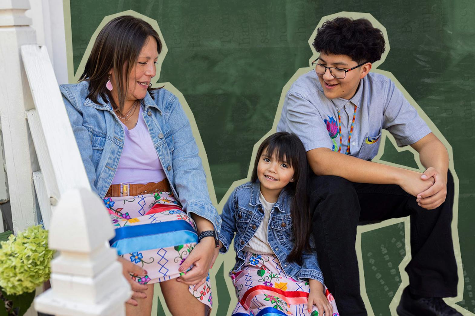 An Indigenous family sits on a porch smiling at each other. The women are wearing colourful ribbon skirts.