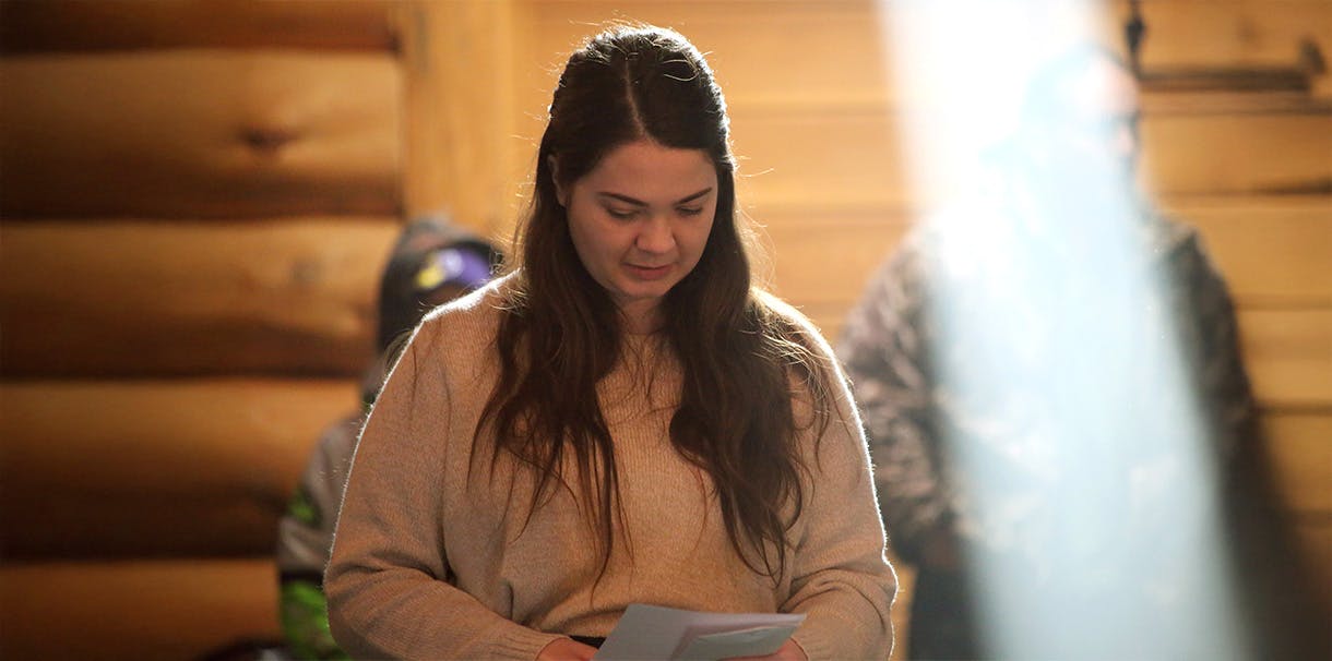 Heather Webb reads a document in a roundhouse