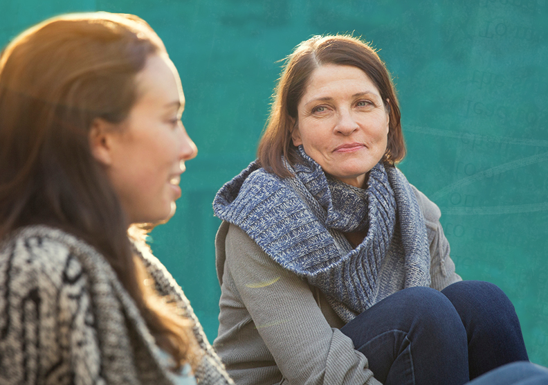 Two women sitting outside and talking