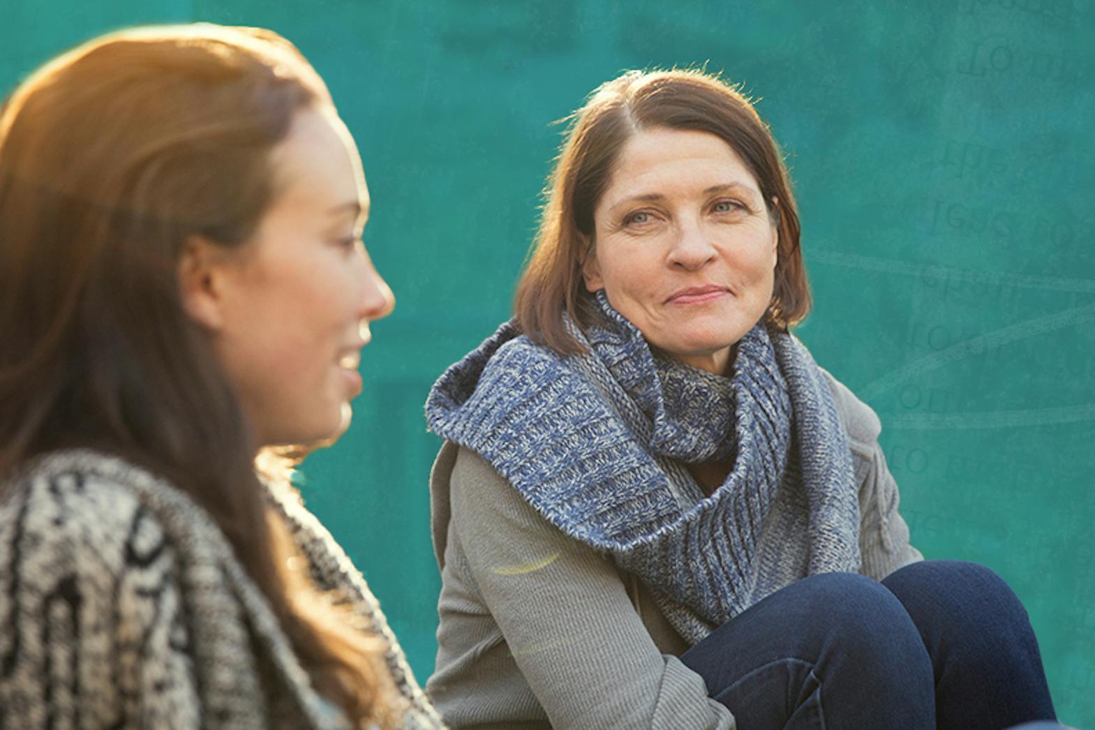 Two women sitting outside and talking