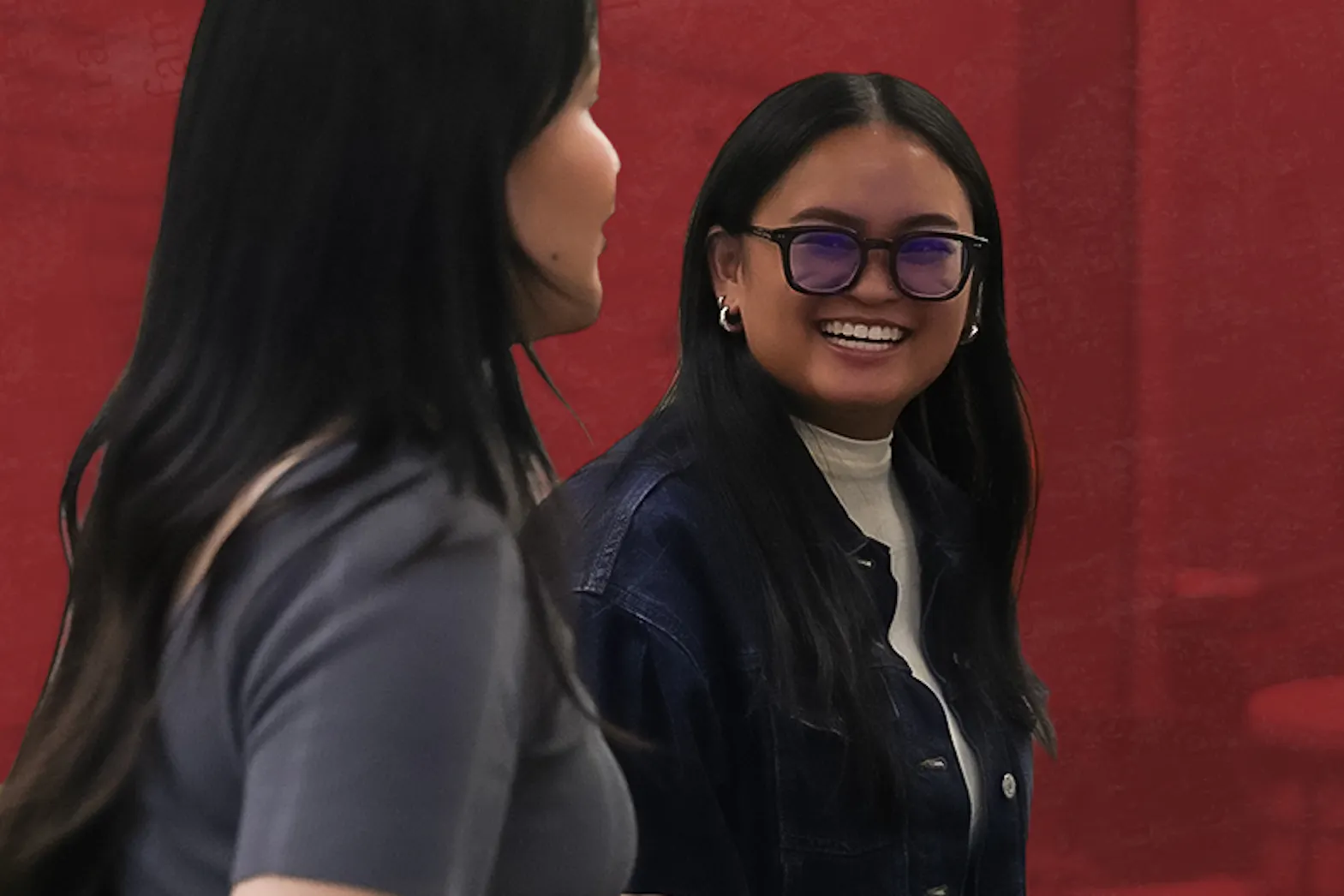 Feabie Medina looks back and is smiling at Fiona David