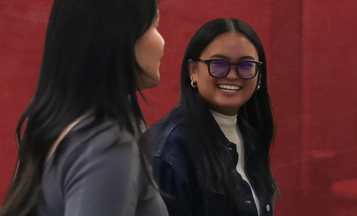 Feabie Medina looks back and is smiling at Fiona David