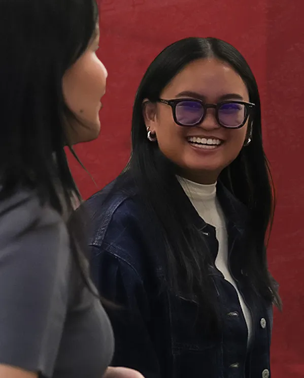Feabie Medina looks back and is smiling at Fiona David