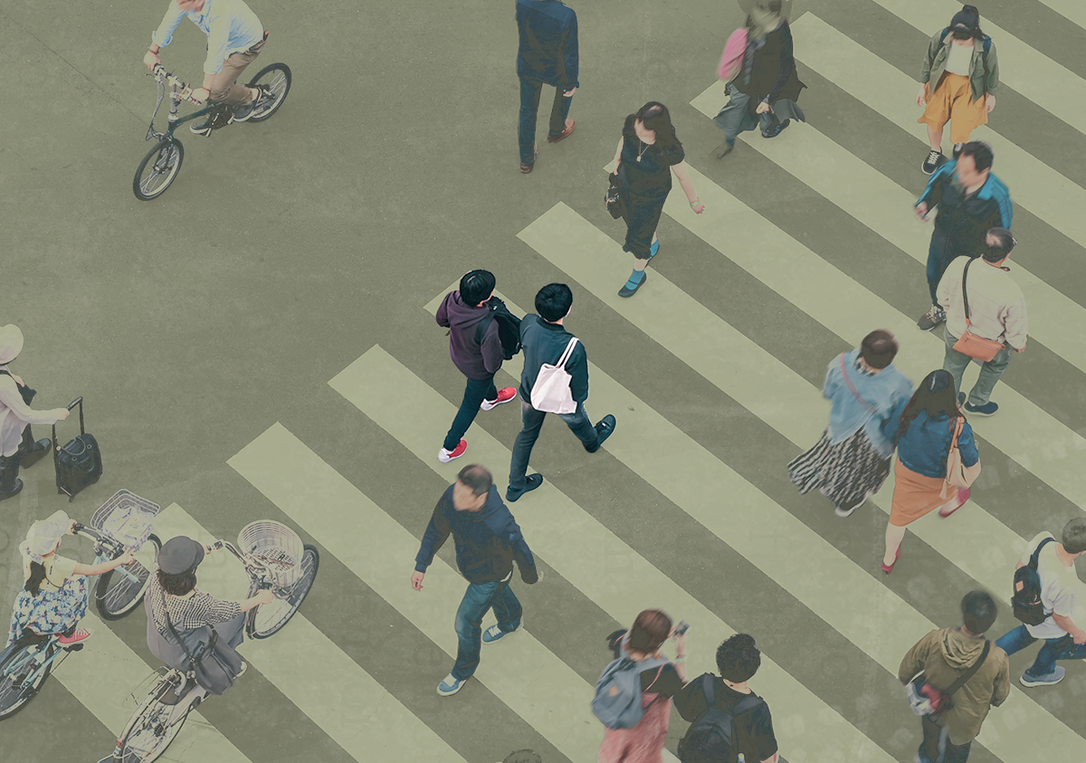 Birds eye view of people crossing a busy crosswalk