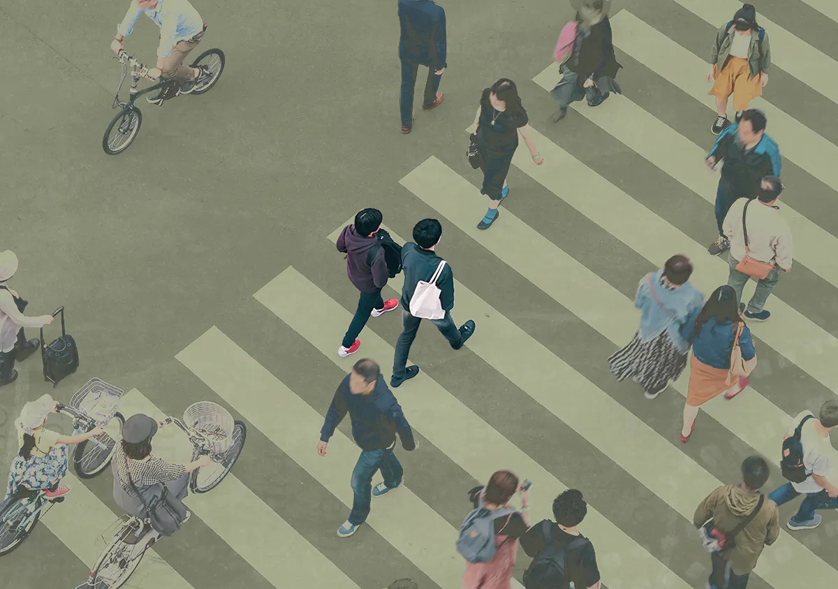 Birds eye view of people crossing a busy crosswalk