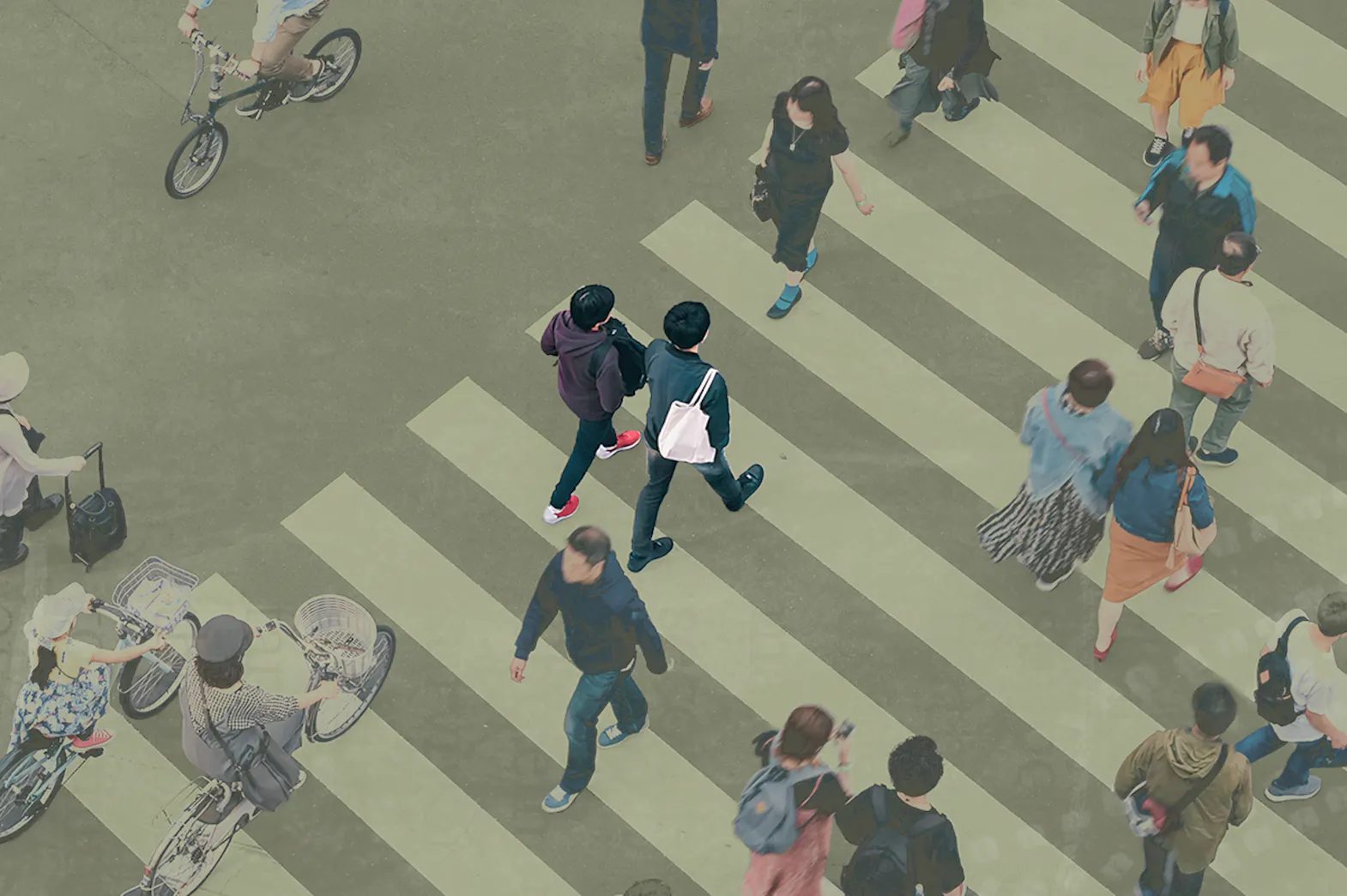 Birds eye view of people crossing a busy crosswalk
