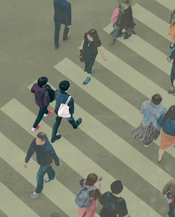 Birds eye view of people crossing a busy crosswalk