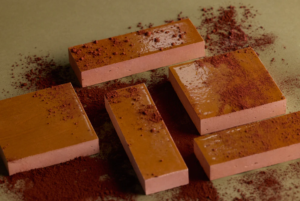 Light brown clay tiles covered in clay powder
