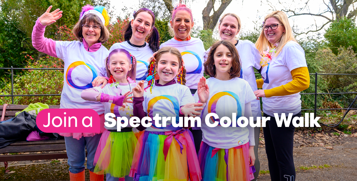 A group of adults and children on a Spectrum Colour Walk