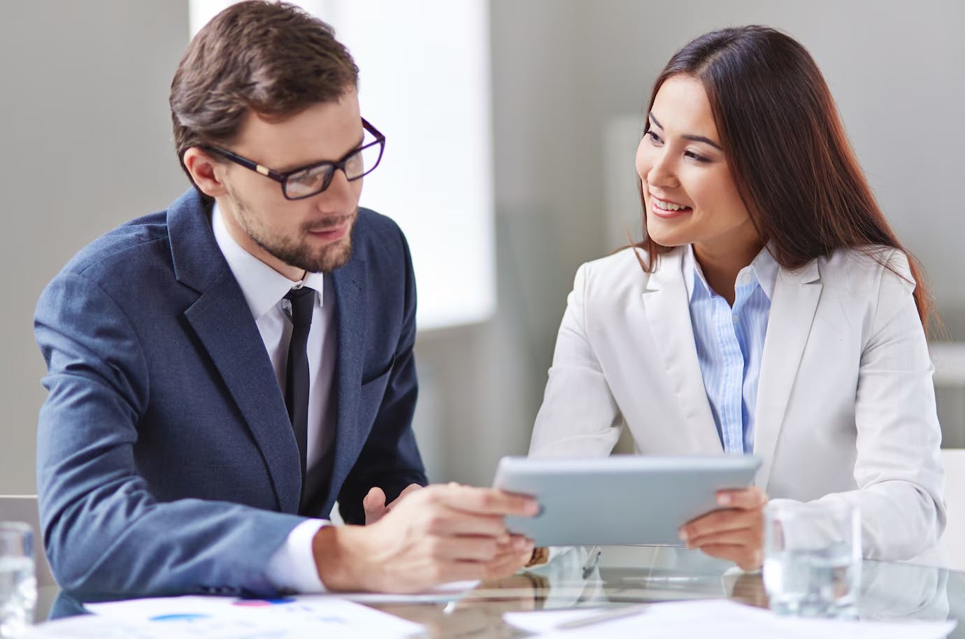 man and woman discussing in a business meeting