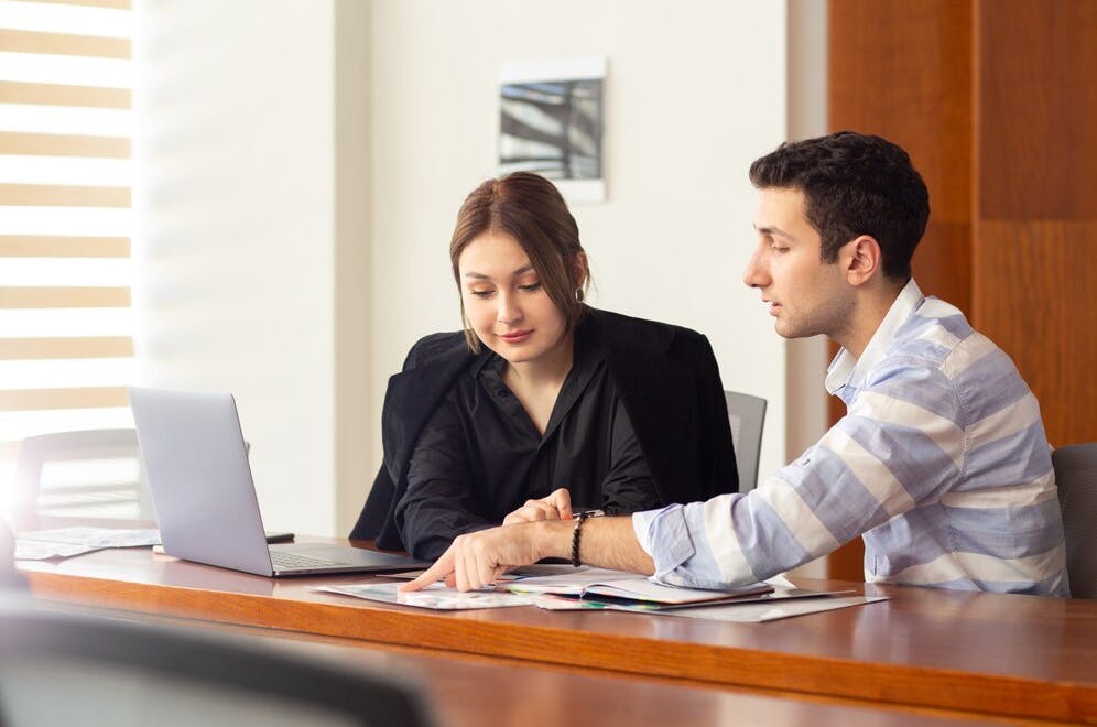 business meeting between compliance consultants