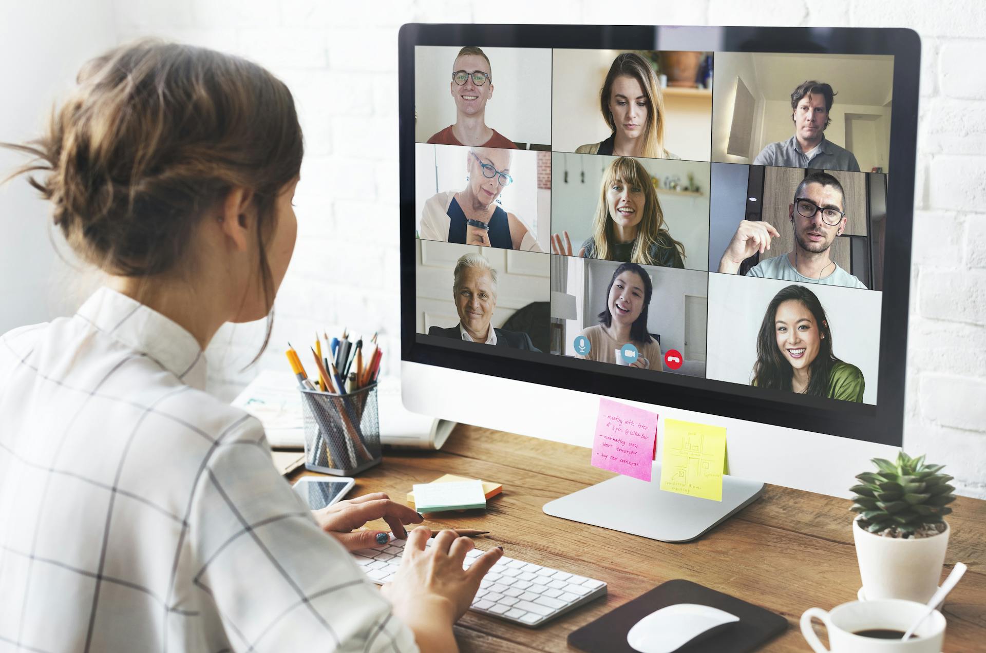 Virtual office with remote team members in a business meeting