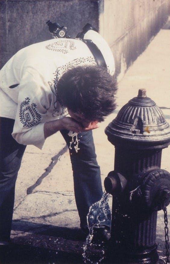 Alvin Baltrop, "Man Drinking from Fire Hydrant," New York