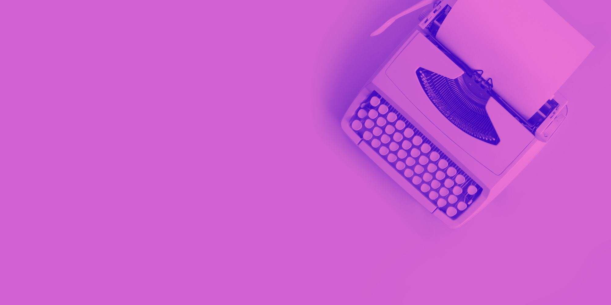 Pink typewriter on a pink background 