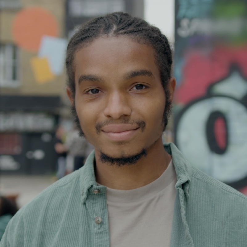 Young man smiling at a camera 