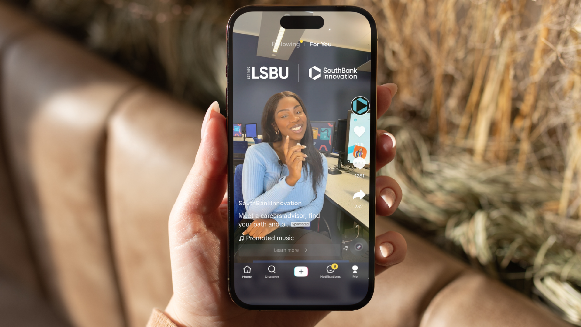 Person holding a phone showing a TikTok from LSBU and SouthBank Innovation on the screen