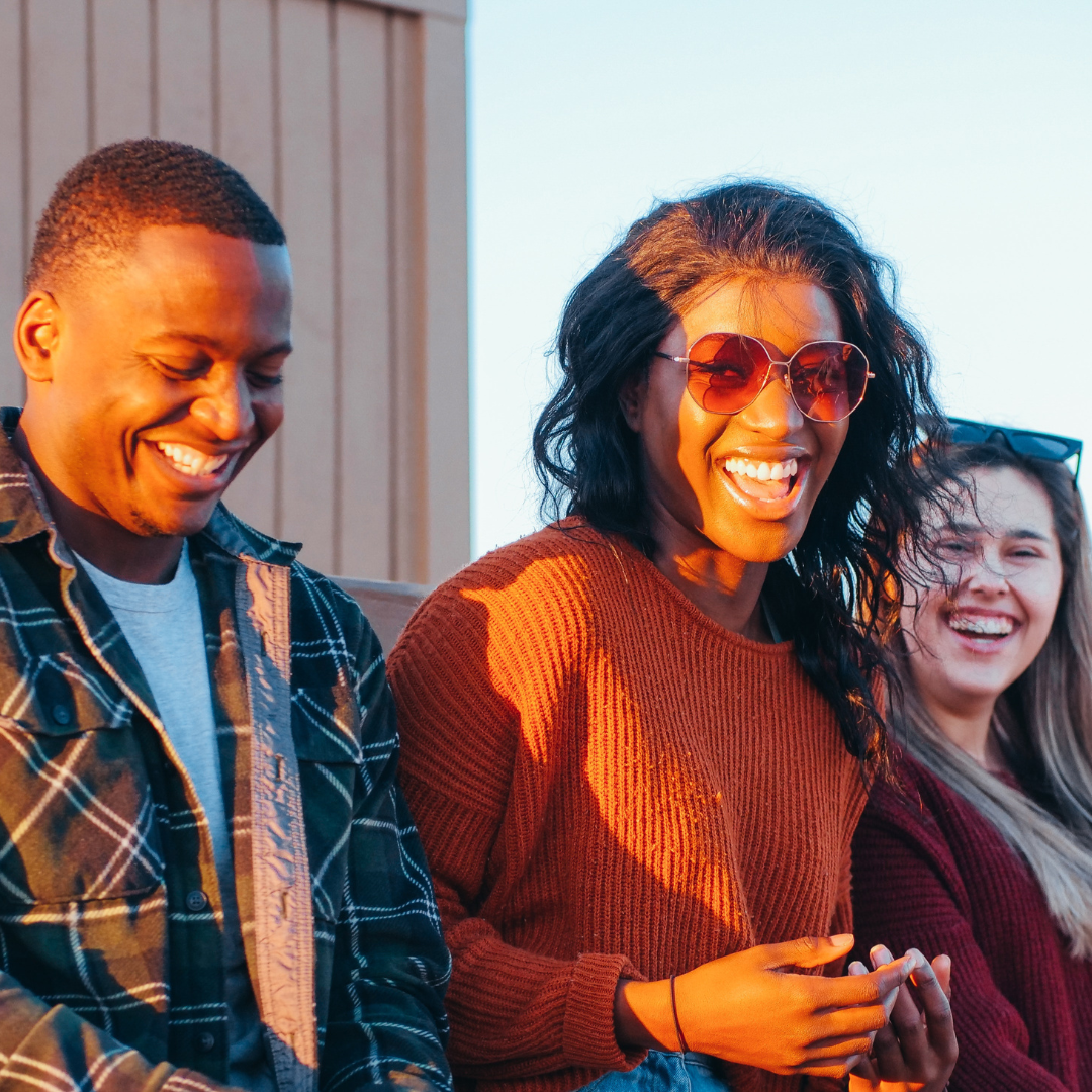 Students smiling at sunset 