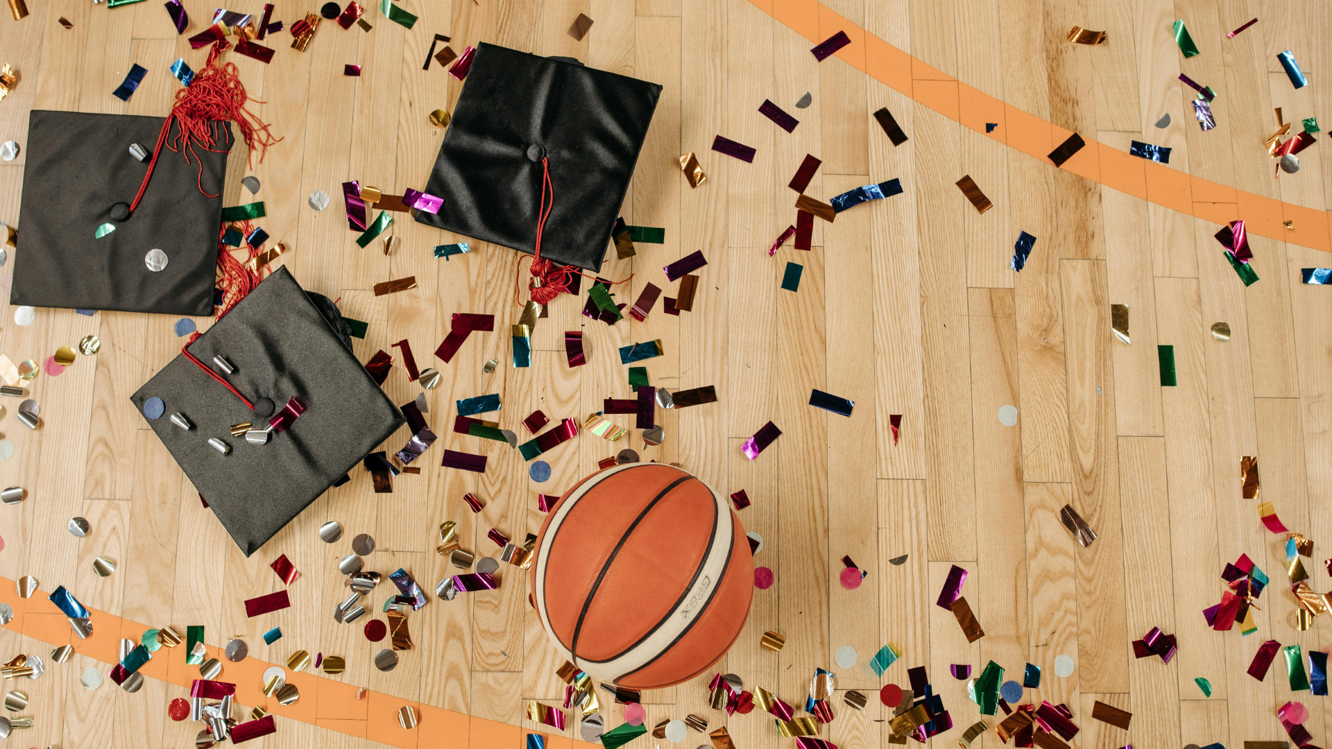 Basketball court with Graduate hats on it