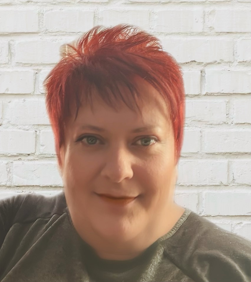 Lorraine smiling on a white background