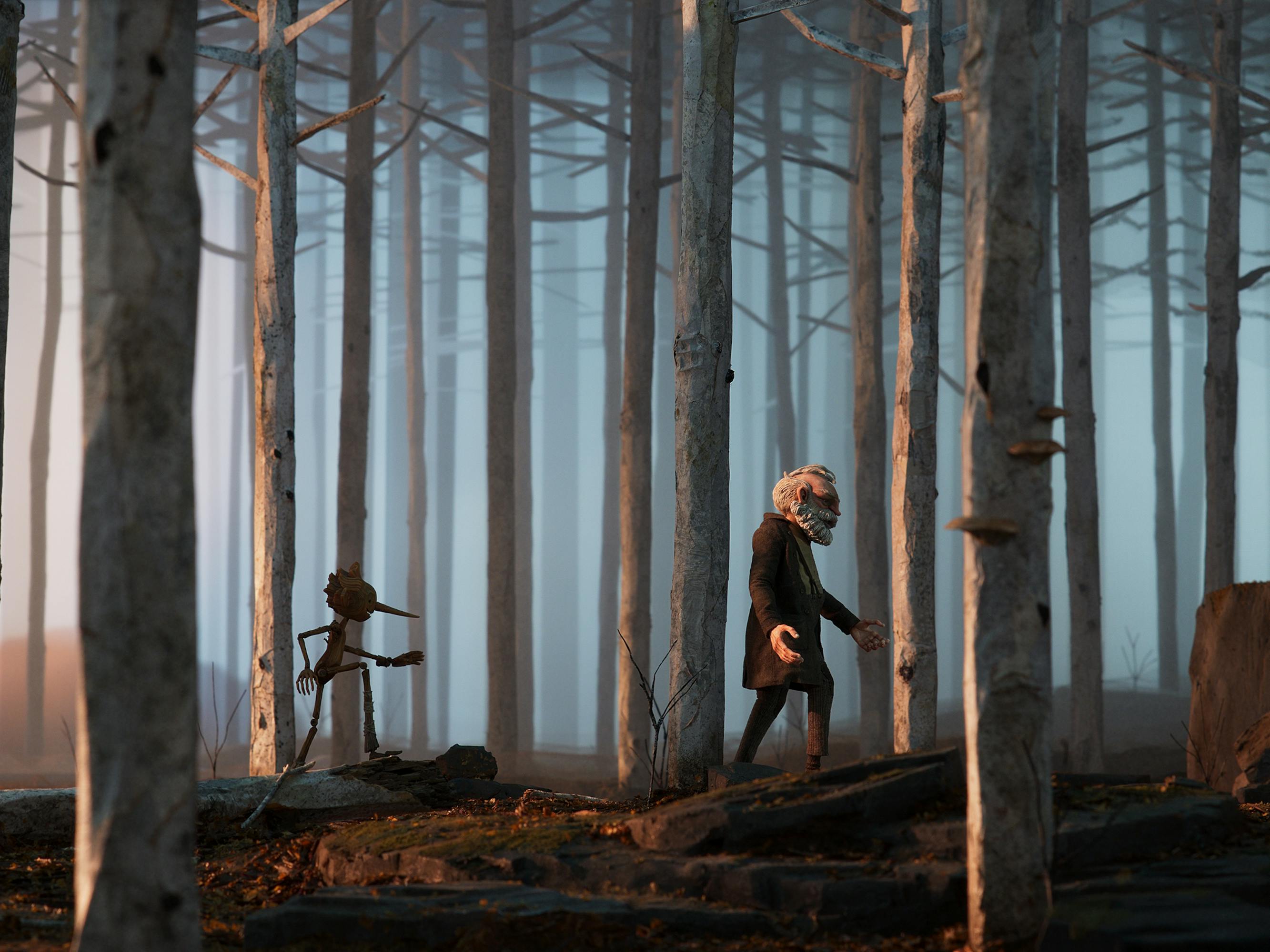 Pinocchio (Gregory Mann) and Geppetto (David Bradley) walk through a misty forest. 