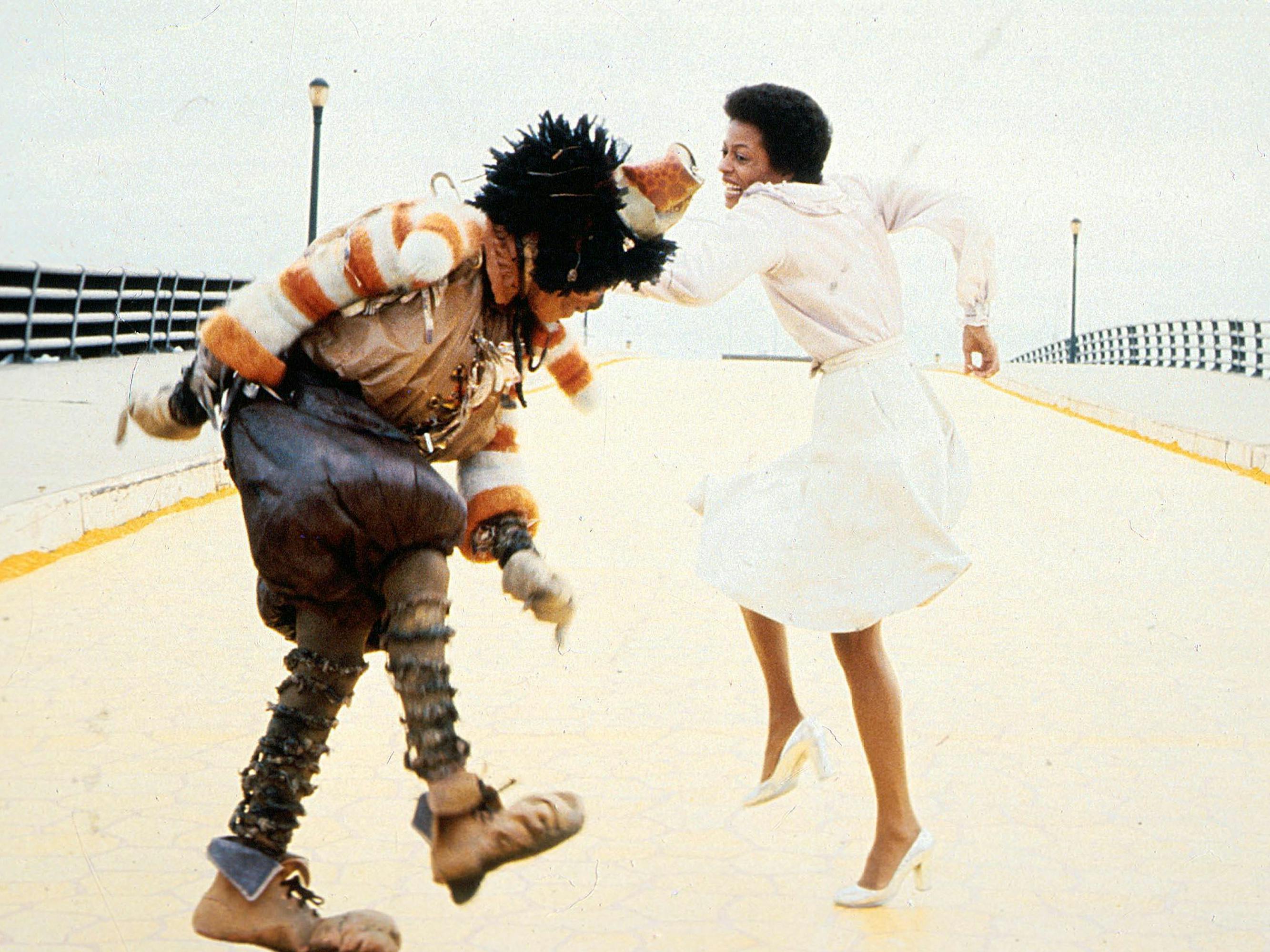 Scarecrow (Michael Jackson) and Dorothy (Diana Ross) dance on a white street.