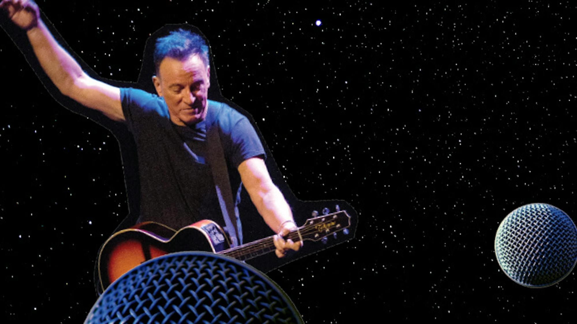 Bruce Springsteen floats amidst microphone tops strumming his guitar in a dark t-shirt.
