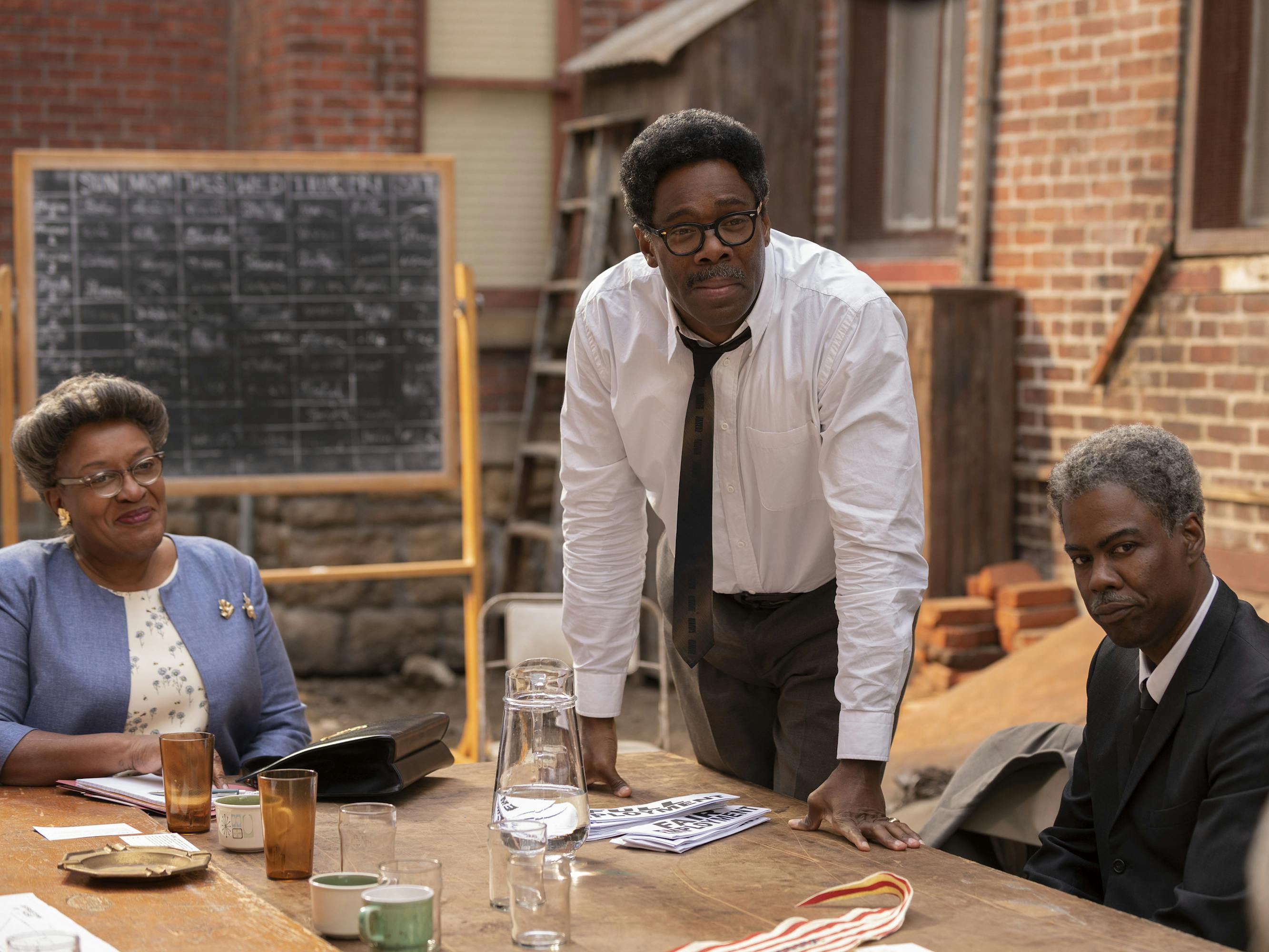 Bayard Rustin (Colman Domingo) and Roy Wilkins (Chris Rock) strategize around a table.