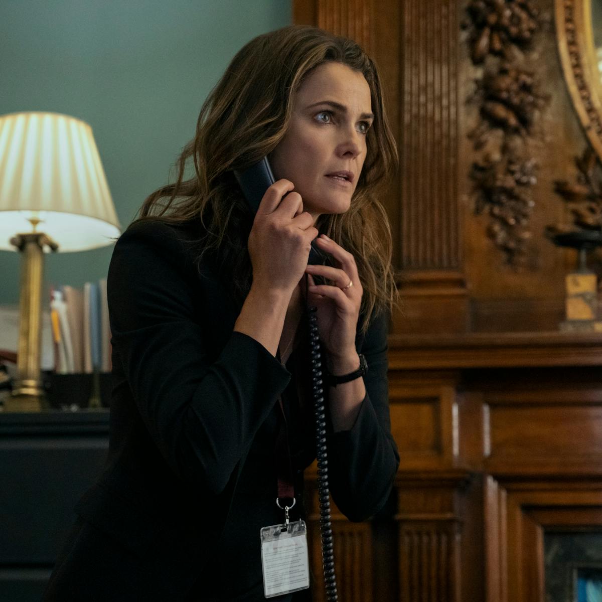 Kate Wyler (Keri Russell) wears all black and talks on the phone.