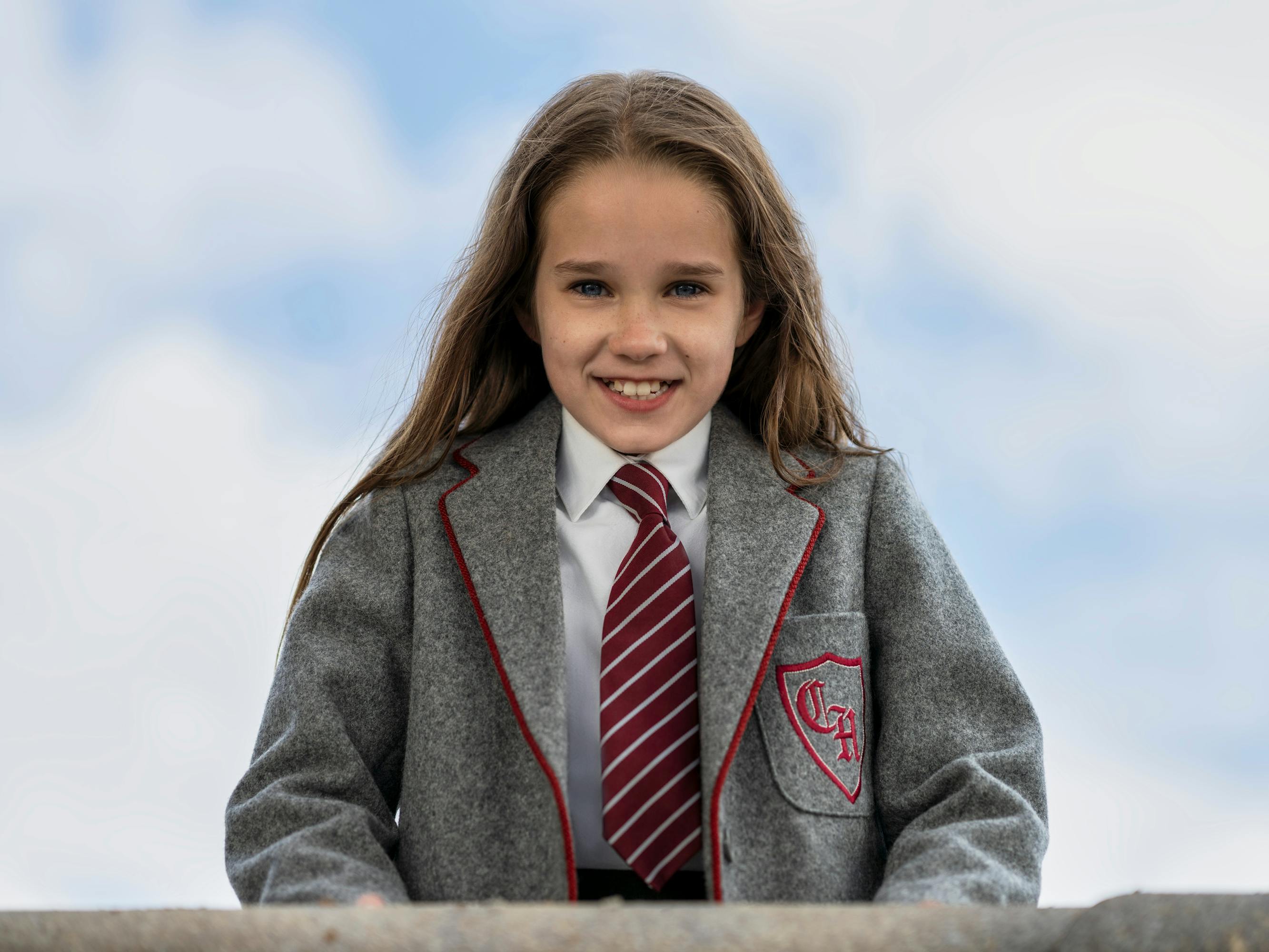 Matilda (Alisha Weir) wears an ADORABLE grey school uniform and tie.