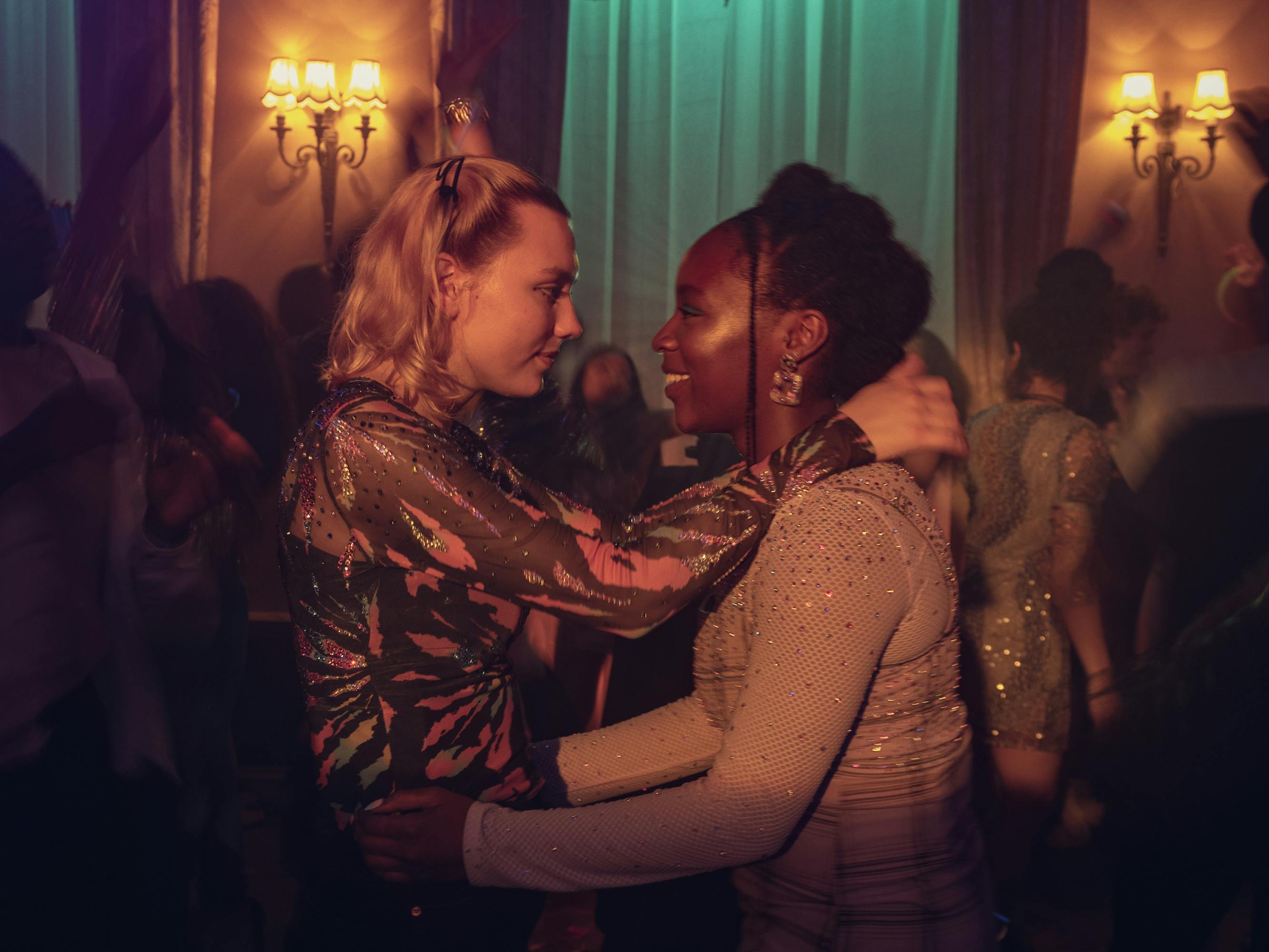 Darcy Olsson (Kizzy Edgell) and Tara Jones (Corinna Brown) dance together.