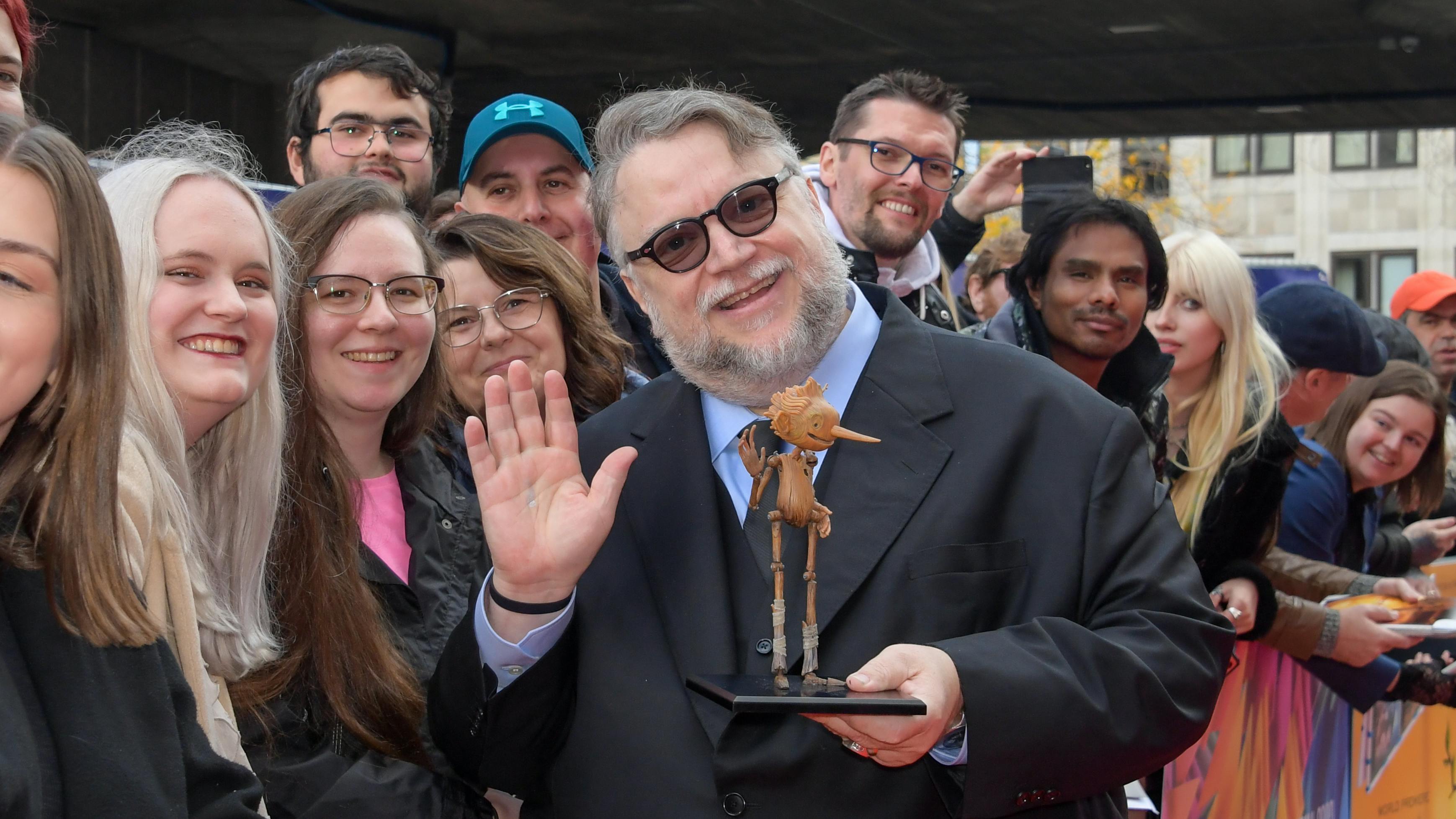 Guillermo del Toro and his Pinocchio puppet greet fans at the BFI London Film Festival.