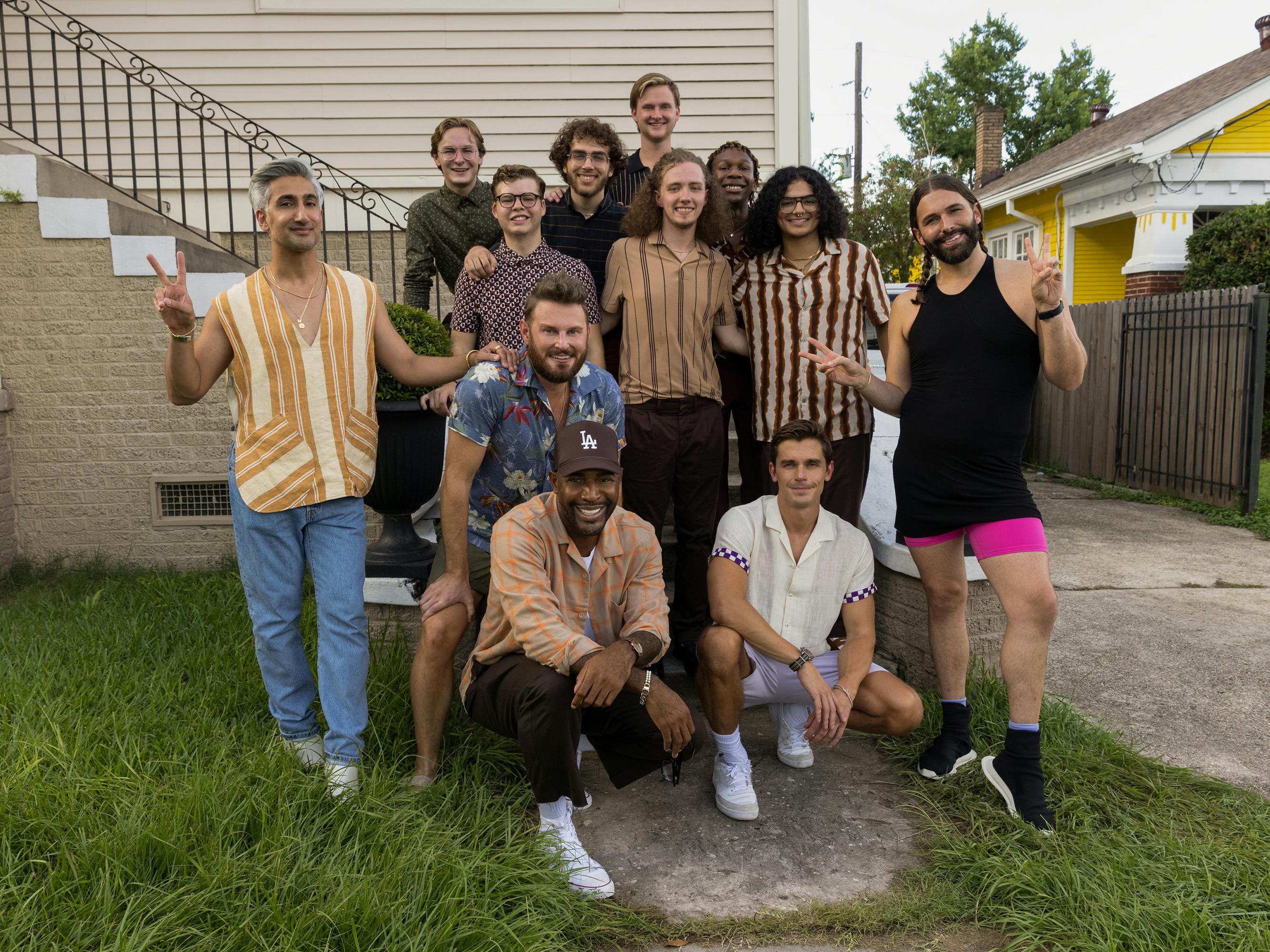 The Fab Five and the brothers of Lambda Chi Alpha stand outside their frat house.