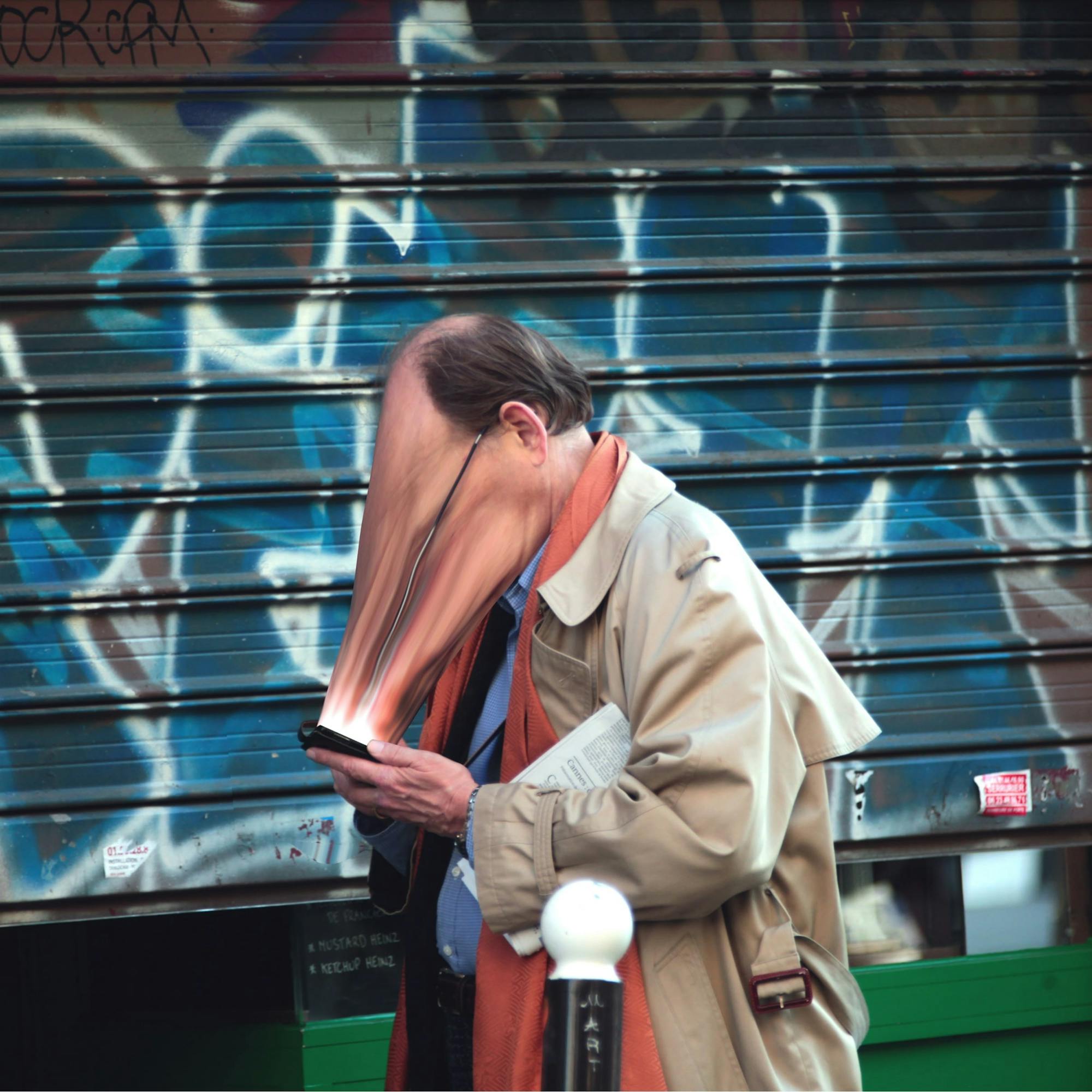 A smartphone user is sucked into their screen