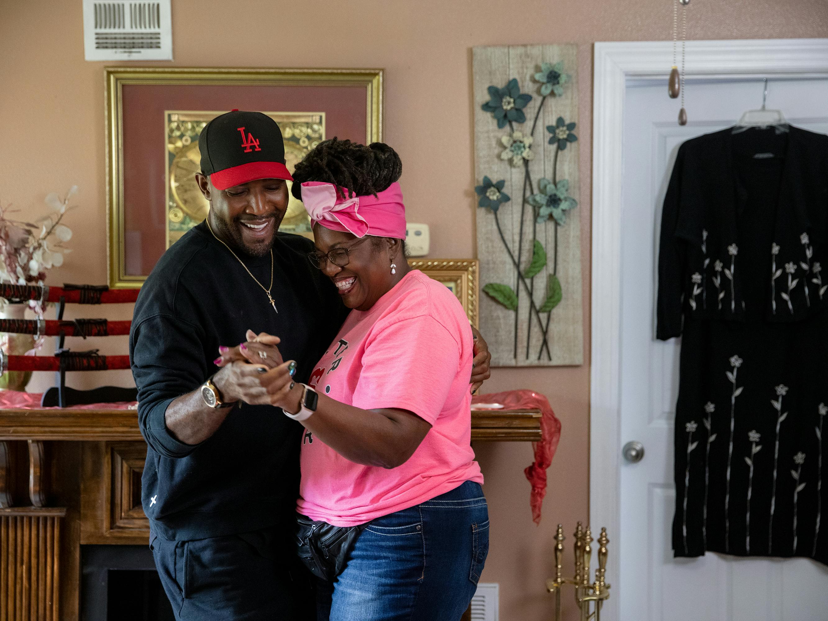 Karamo and Maryam Henderson-Uloho dance in a homey looking room.