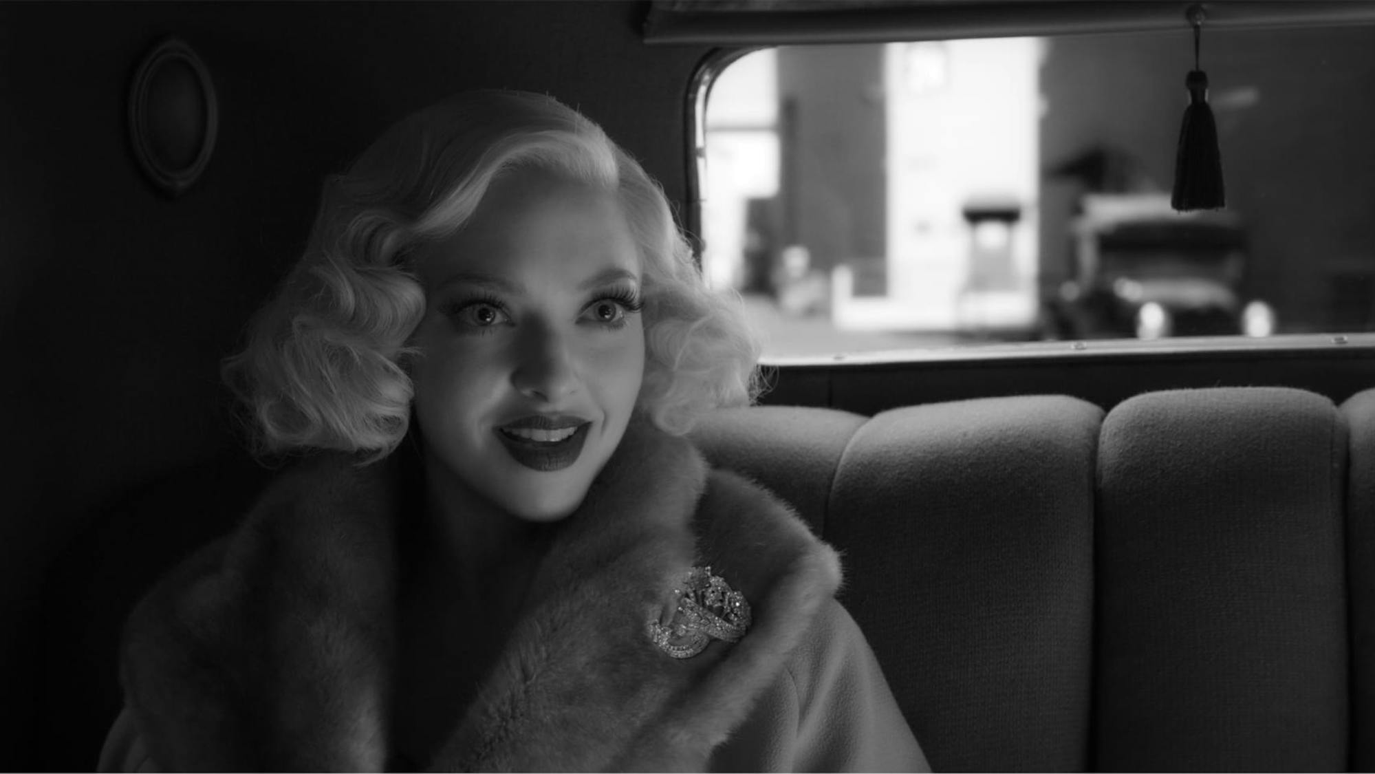 In a shot from the film, we see how those lipstick debates pay off in black and white. The contrast on Seyfried is just so. 