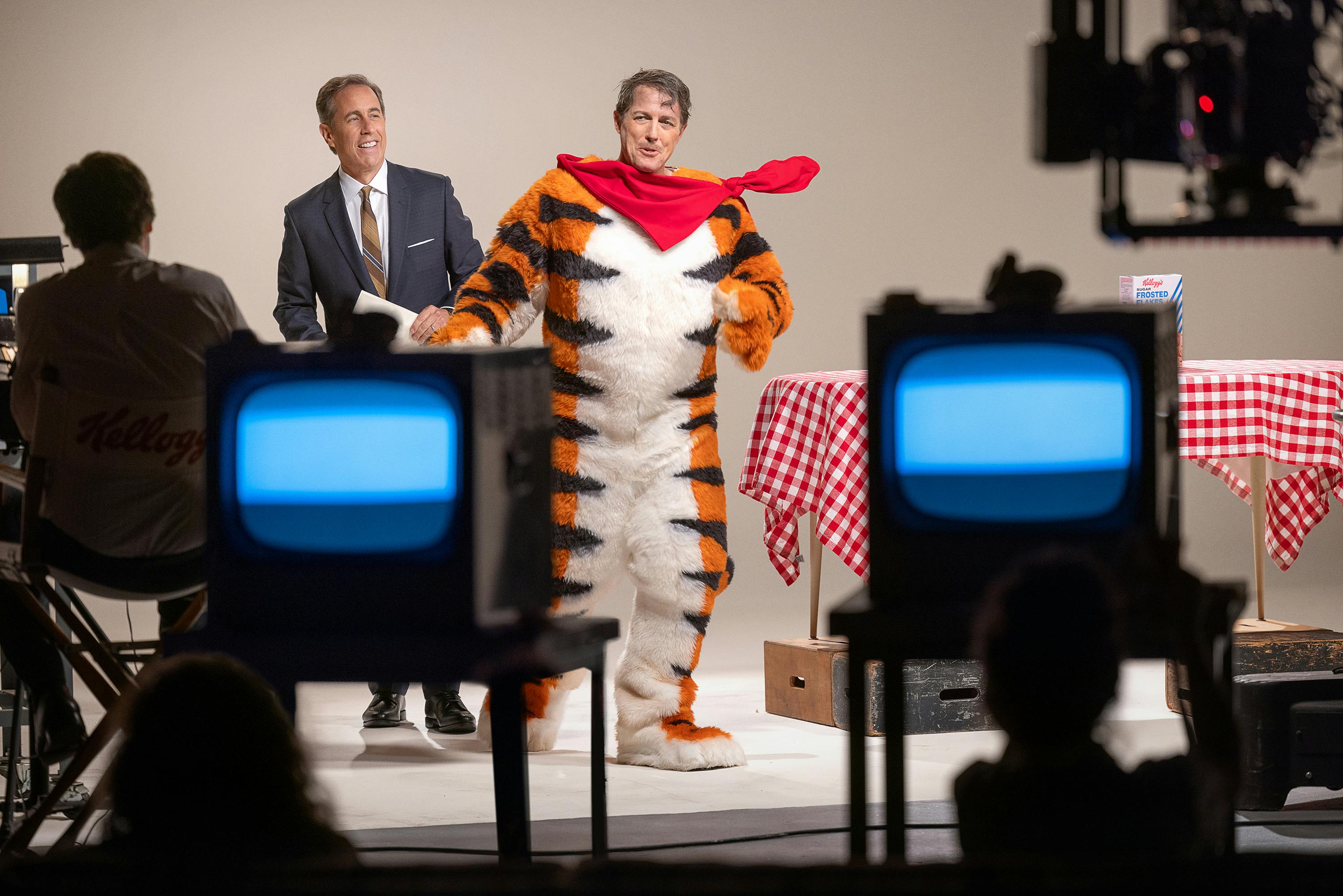 Jerry Seinfeld and Hugh Grant on set. Grant wears the Tony the Tiger costume, sans head.