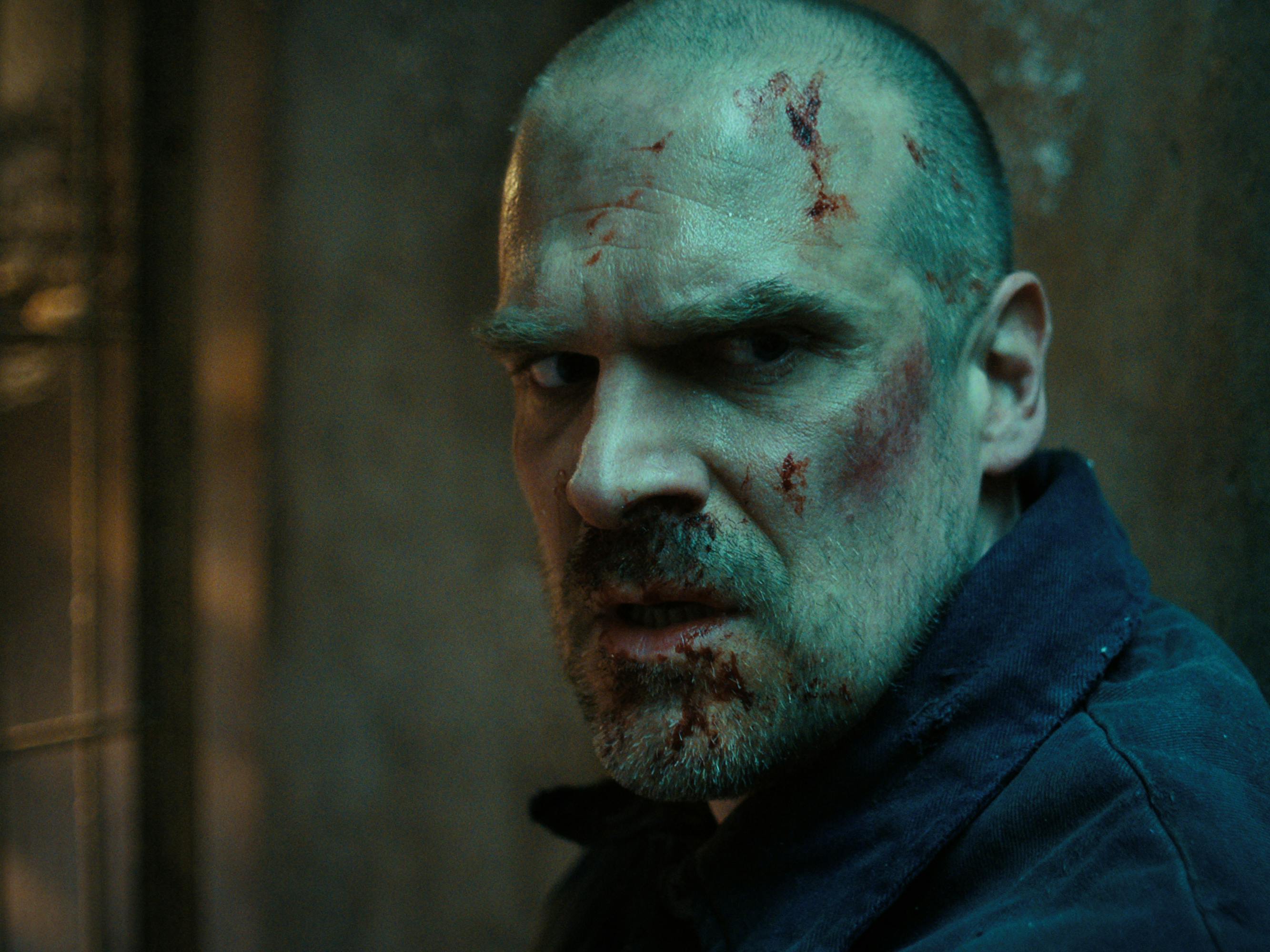Jim Hopper (David Harbour) is bald and looks terrifying in this close-up shot.
