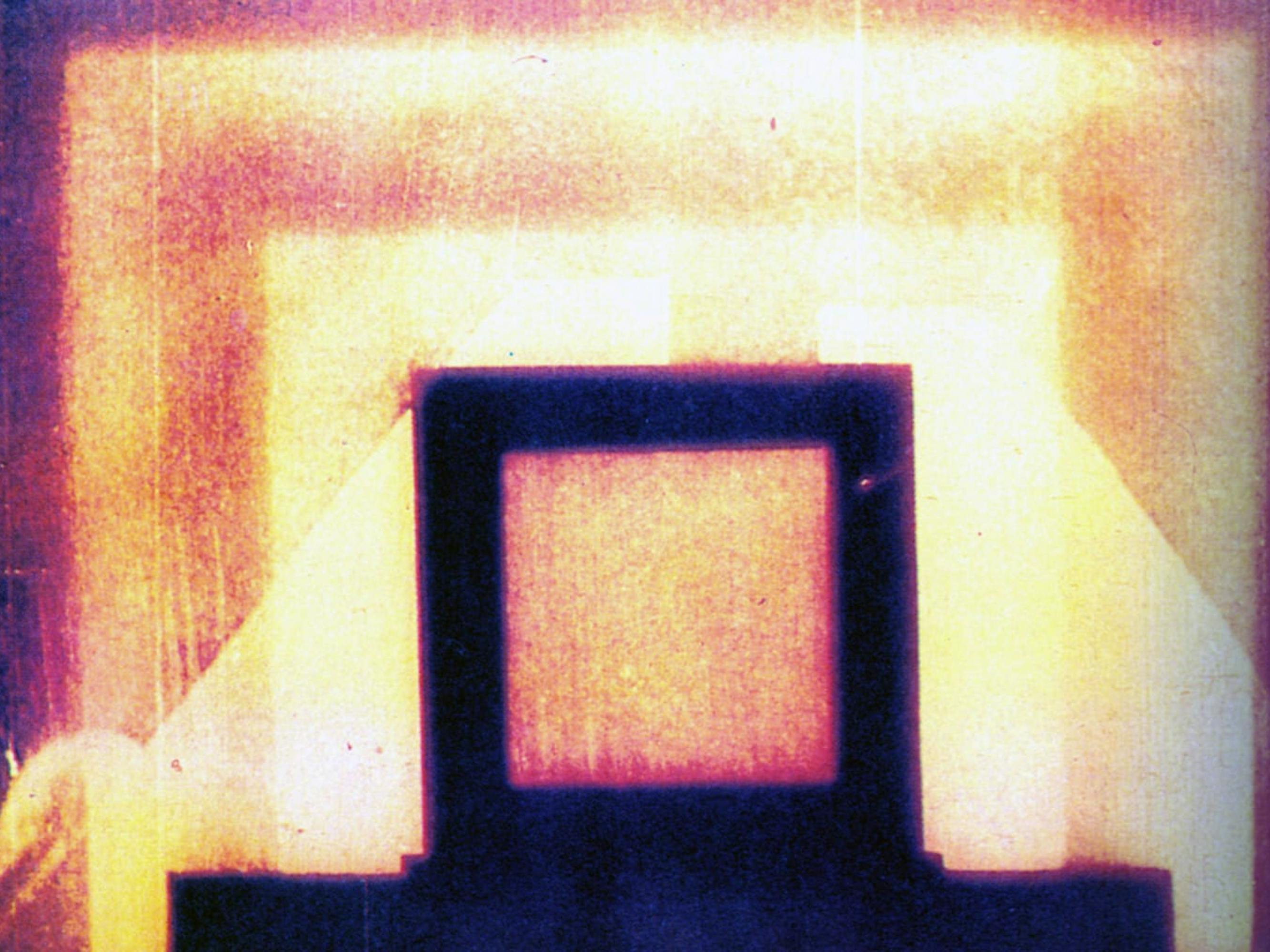 A black, red, purple, and yellow image with multiple squares framing each other.