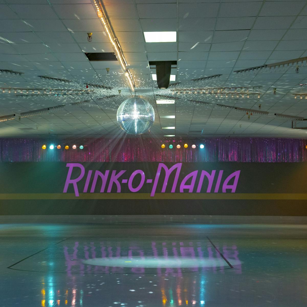 A neon-lit shot of Rink-o-Mania, complete with disco ball.