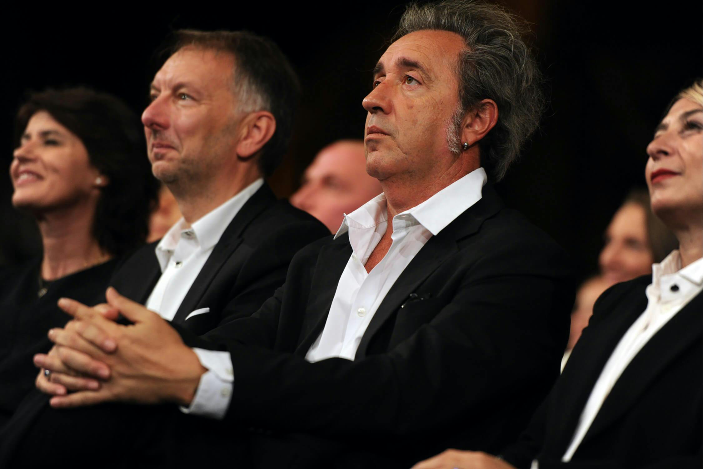 Paolo Sorrentino and Daniela D'Antonio, both in black suits and white shirts