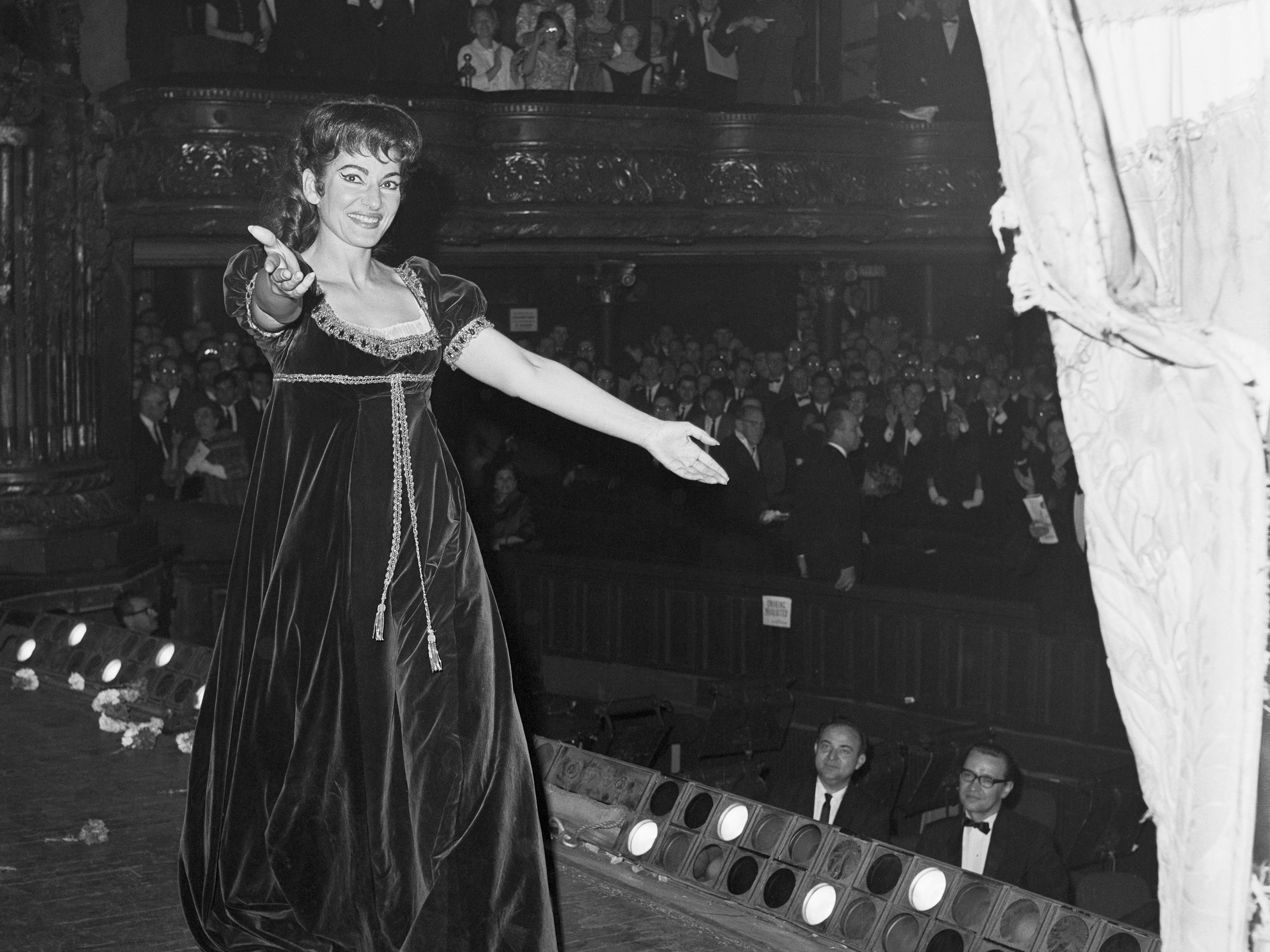 Maria Callas wears a velvet babydoll dress onstage.