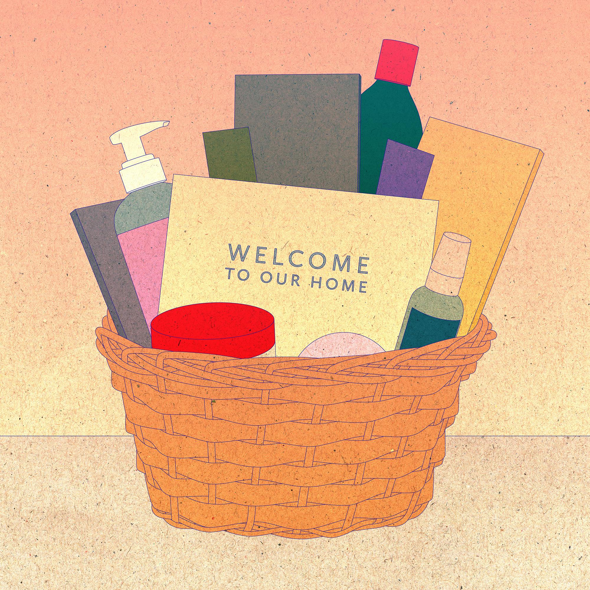 A welcome basket with books and bath products.