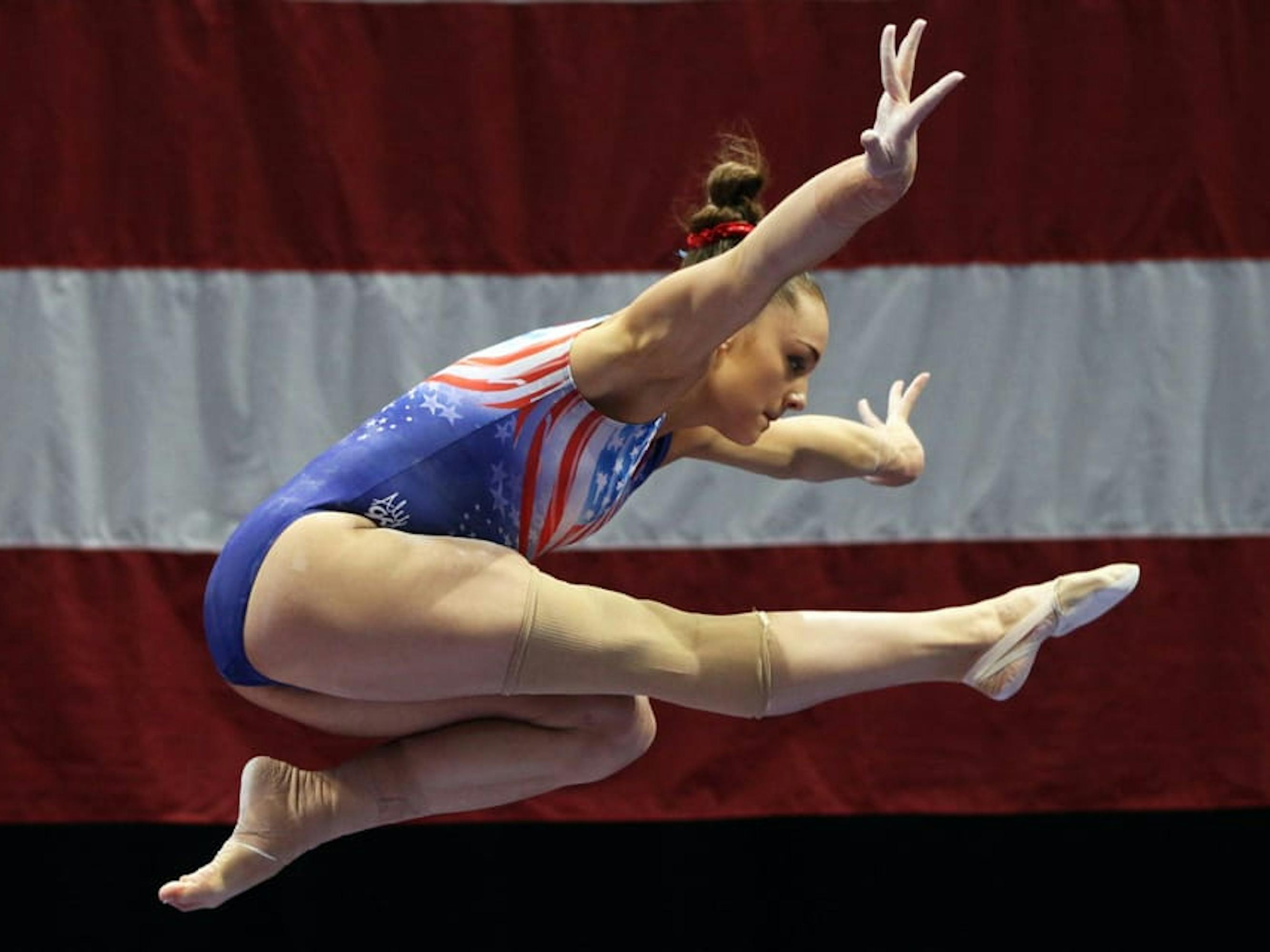 Nichols flies in front of an American flag.