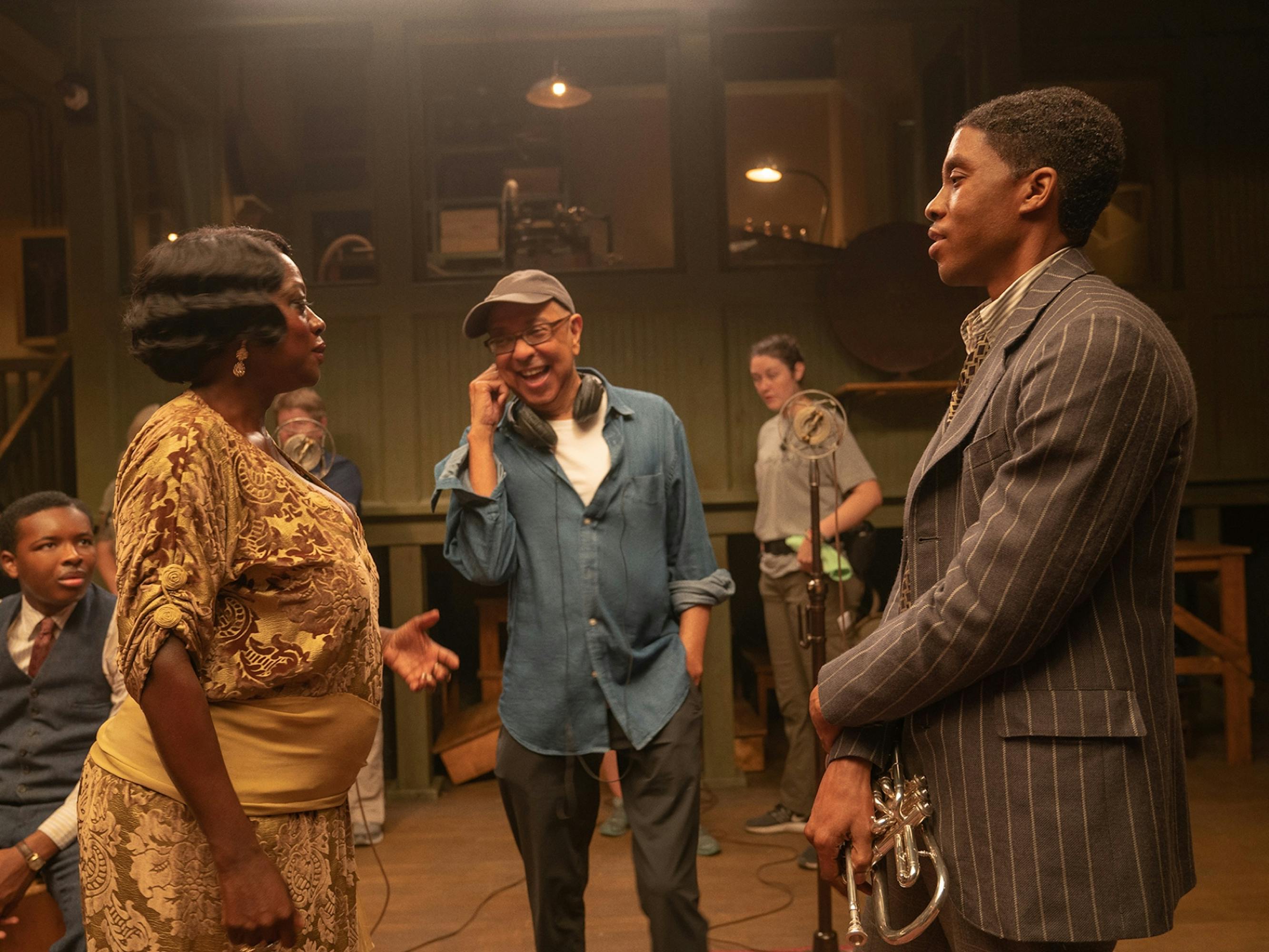 George C. Wolfe directs Viola Davis, looking glamorous in a drapey gold number, and Chadwick Boseman, dapper in pinstripes, in between takes of Ma Rainey’s Black Bottom.